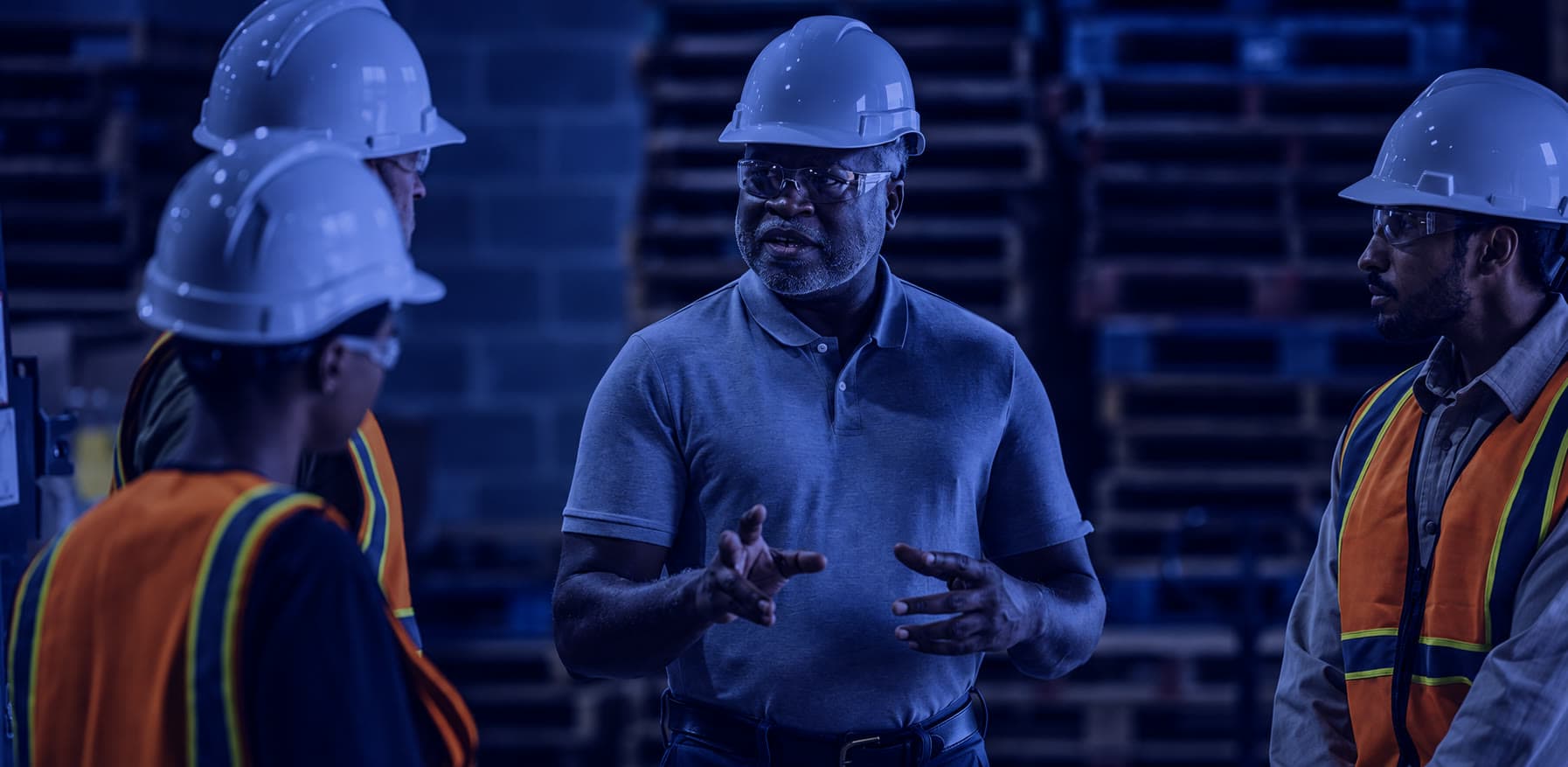 Workers collaborating in a safety-focused industrial environment