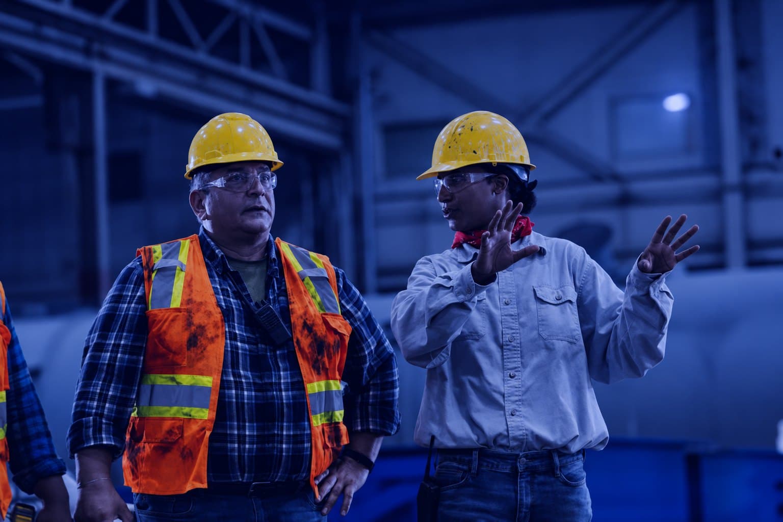 Two leaders talking through a job on the plant floor